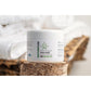 CBD muscle balm tub shown on a log